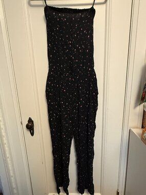 Sleeveless jumpsuit, black with floral pattern